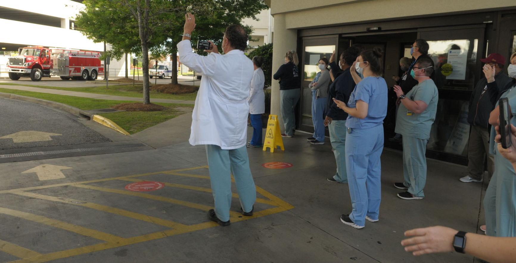 First responders give rolling salute to local health care workers